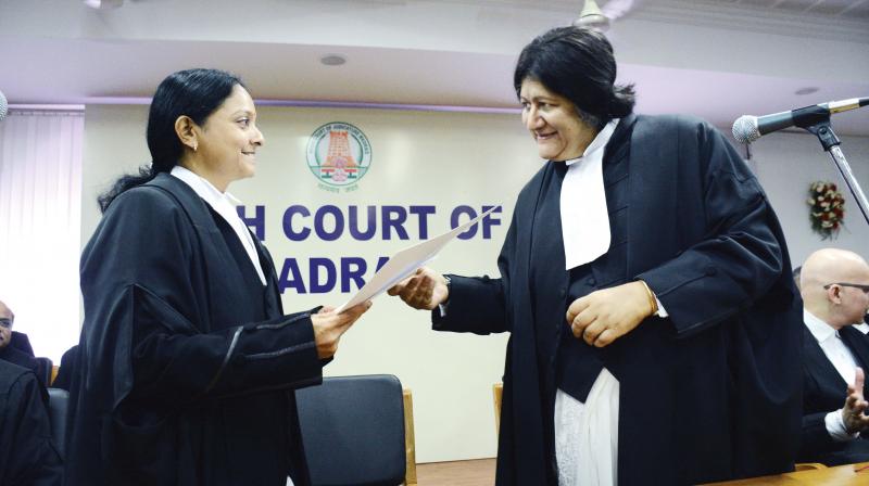 Madras HC Chief Justice Indira Banerjee (right) greets Justice R. Hemalatha after administering oath to her. (Photo: DC)