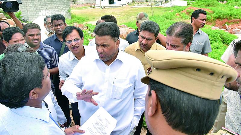 TRS MLC and Telangana State Wakf Board chairman Mohammed Saleem, CEO of  Wakf Board M.A. Mannan Siddiqui and officials inspect illegal encroachments on Wakf land belonging to Hazrath Roohullah Bandagi Ali Dargah, Madina Masjid and Qutub Shahi and Muslim graveyards, at Naknampur village, Hyderabad. (Photo:DC)