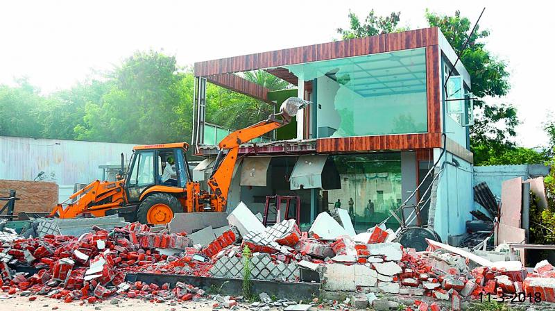 Secunderabad Cantonment Board demolishes a building at Tadbund on Saturday despite pleas by the owners that it was a legal structure.