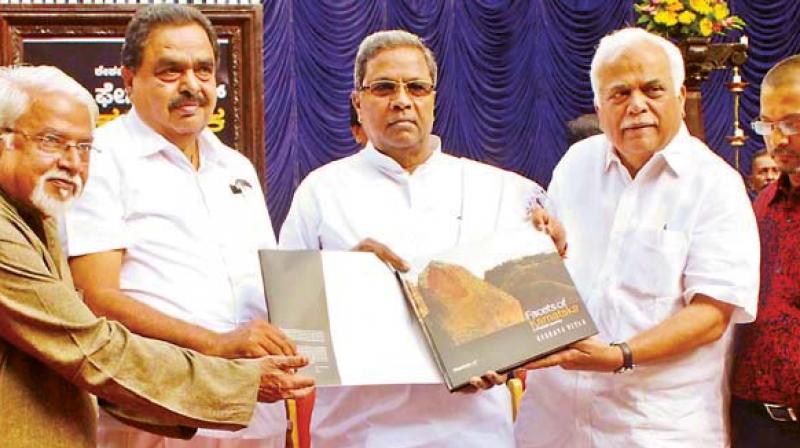 Outgoing CM Siddaramaiah (left) and outgoing industries minister R V Deshpande