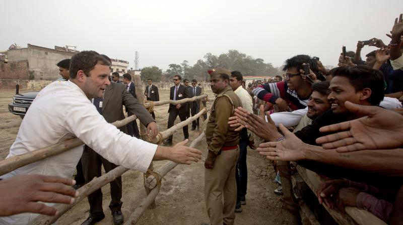 Congress party Vice President Rahul Gandhi greets supporters during an election campaign rally in Raebareli. (Photo: PTI)