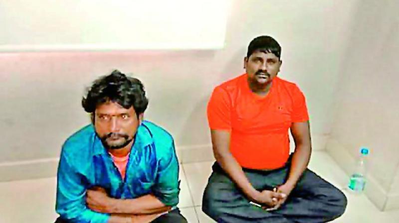 The accused in the murder of Jerigalla Ramesh, V. Kishan Goud and A. Laxman Goud, after they were arrested and taken to the police station on Wednesday.