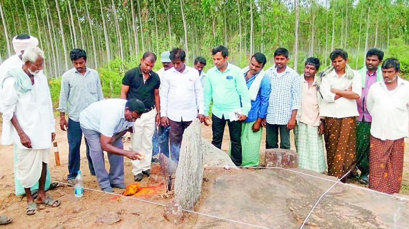 Archaeology Deputy Director K. Saibhakta Kesav launchess excavation works for the megalithic burials at Rayanipeta village of Yetapaka mandal on Monday. (Photo: DC)