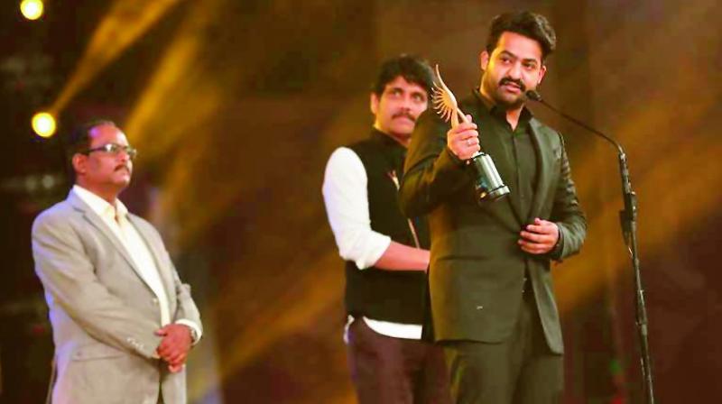 Winners: Jr NTR receives the Best Actor award on Wednesday for his role in Janata Garage. Right, Shruti Haasan received the Best Actress award at SIIMA last year for Srimanthudu