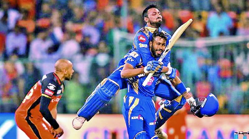 Krunal Pandya celebrates with his brother Hardik Pandya after Mumbai Indians defeated Royal Challengers Bangalore in the group stage of the IPL. (Photo: BCCI)