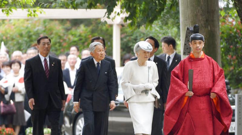 Japans Emperor Akihito, second from left, and Empress Michiko, led by a priest, right, visit Koma Shrine in Hidaka, northwest of Tokyo, Wednesday, Sept. 20, 2017. (Photo: AP)