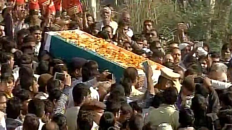 As the 40-year-olds body wrapped in tricolour was brought in a bedecked vehicle, a large number of people from the village and neighbouring areas reached Rohtak to pay their last respects. (Photo: Twitter/ANI)