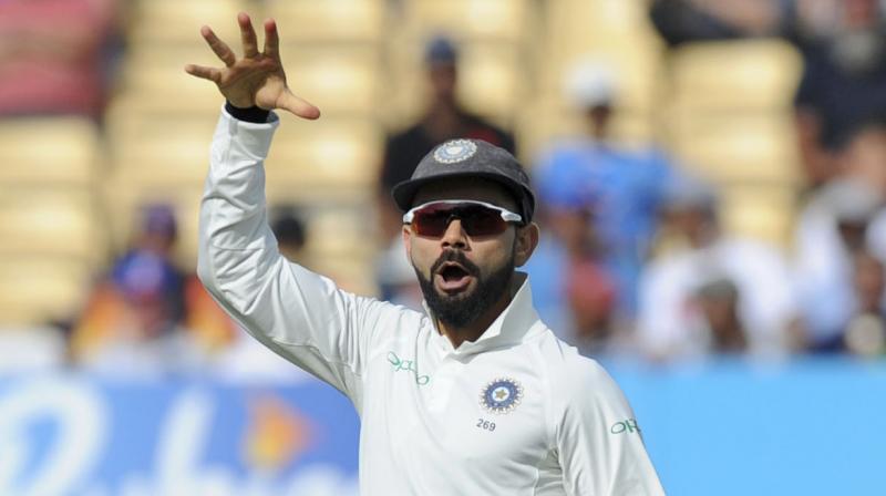 Virat Kohli celebrated the Joe Root dismissal with a mic-drop send-off, something Root had done after guiding England to a 2-1 ODI series win against India last month. (Photo: AP)