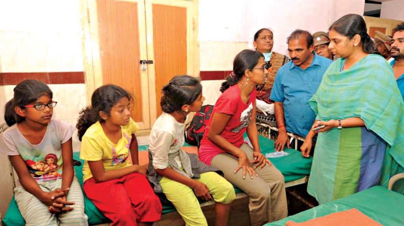 Theni district collector Pallavi Baldev visits the Bodi Government Hospital and talks to the rescued trekkers on Sunday.