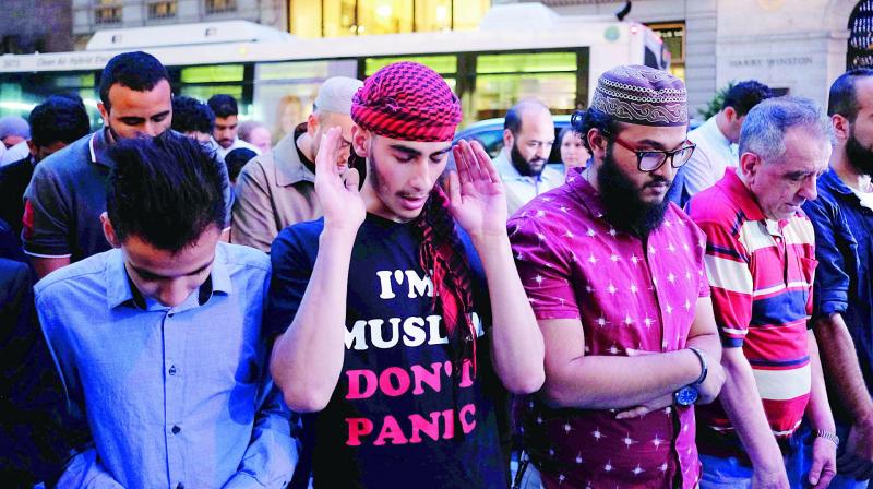 Muslims pray on the Fifth Avenue after Iftar, breaking fast during their holy month of Ramzan  during a demonstration to protest US President Donald Trumps stand on Muslim and immigrants, near the Trump Tower in New York recently. (Photo: AFP)