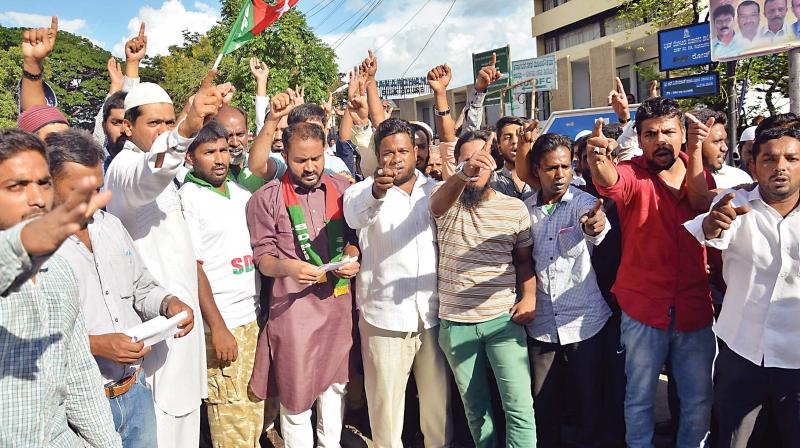 Members of the Social Democratic Party of India protest against the Centres decision to ban cattle  slaughter, in Bengaluru on Friday (Photo: KPN)