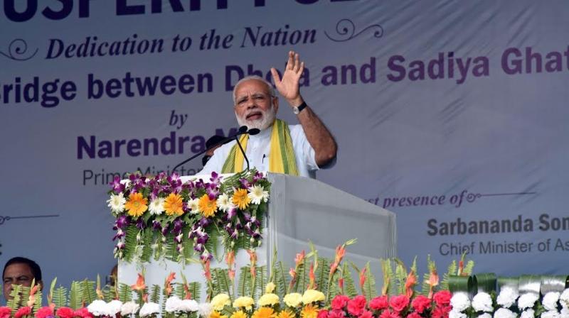 Prime Minister Narendra Modi addressing a public gathering in Assam. (Photo: Twitter)