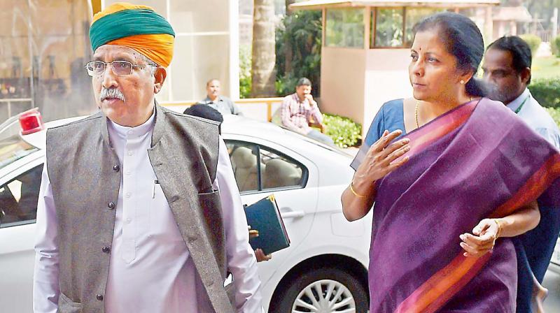 Minister of State for finance Arjun Ram Meghwal with Commerce minister Nirmala Sitharaman during the Budget session of Parliament in New Delhi on Monday (Photo: AP)