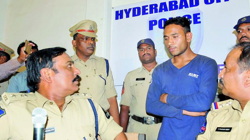 South Zone DCP V. Satyanarayana at a press meet on Friday after the arrest of Muneeruddin (blue dress) who allegedly killed Md Uroojuddin Ahmed, 12.