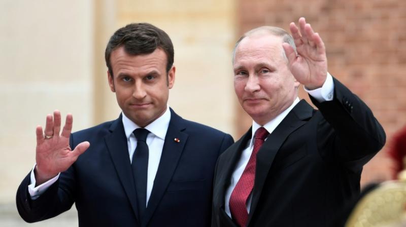 A year ago Emmanuel Macron (L) hosted Vladimir Putin in Versailles, with the French leader accusing Russian media of producing lying propaganda during a joint press conference. (Photo: AFP)