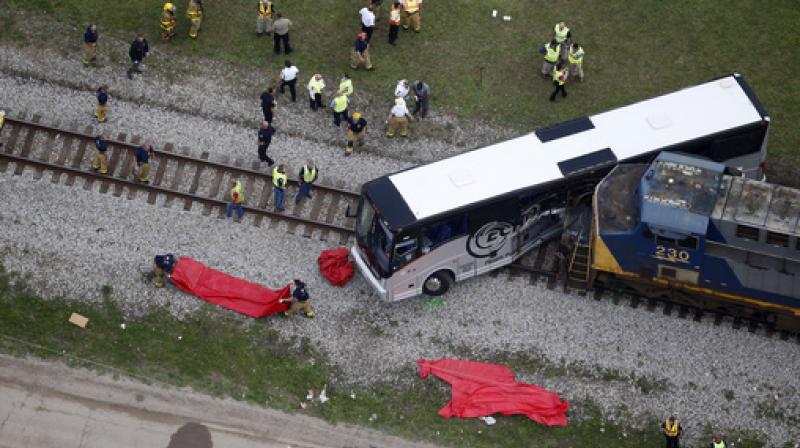 A freight train smashed into a charter bus in Biloxi, Mississippi, on Tuesday, pushing the bus 300 feet down the tracks authorities said. (Photo: AP)