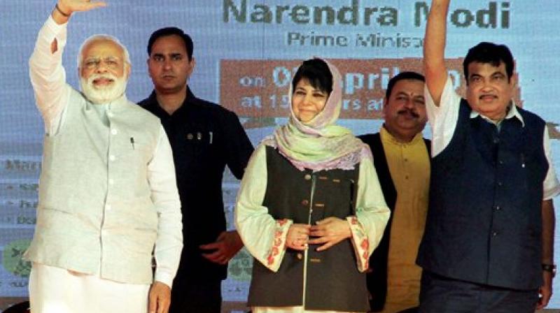 Prime Minister Narendra Modi (L), J&K Chief Minister Mehbooba Mufti (C) and Union Transport Minister Nitin Gadkari at a public rally in Udhampur, Jammu on Sunday. (Photo: PTI)