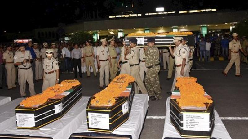 Security persons shouldering the coffin of CRPF jawans after a wreath laying ceremony at Patna airport on Tuesday. 25 CRPF jawans were killed in a Naxal attack in Chhattisgarhs Sukma district on Monday. (Photo: PTI)
