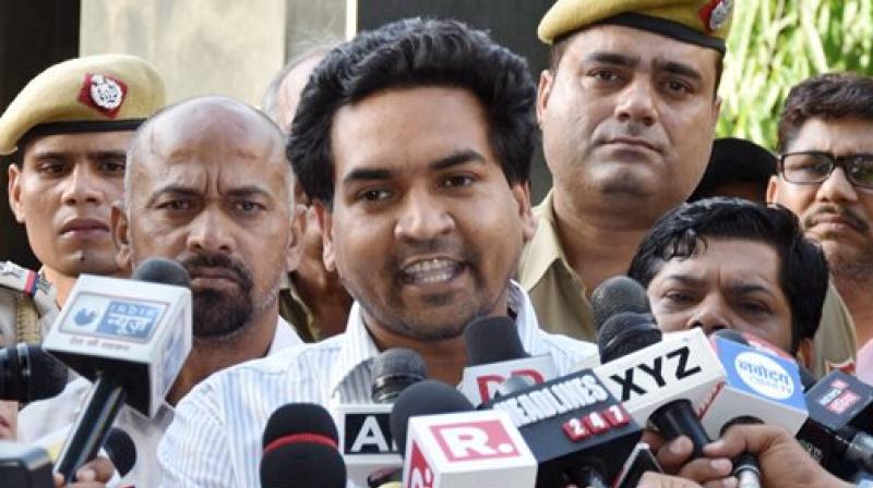Sacked Delhi minister Kapil Mishra talking to the media after he was discharged from RML Hospital in New Delhi on Monday. (Photo: PTI)