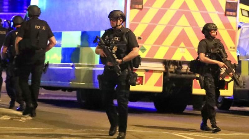 Armed police respond after reports of an explosion at Manchester Arena during an Ariana Grande concert in Manchester, England, Monday, May 22, 2017. (Photo: AP)