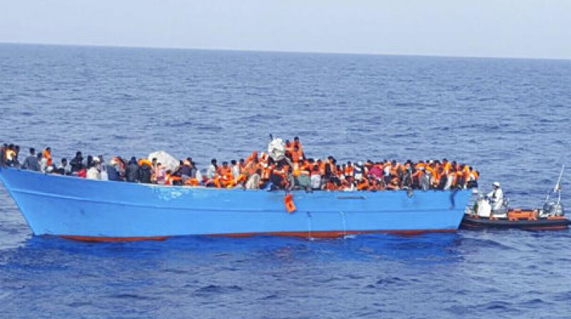 Migrants on a boat are given life vests before being rescued at sea, Wednesday, May 24, 2017. At least 34 bodies of migrants, many of them young children, were recovered from the sea off Libya after some 200 migrants tumbled into rough waters when their overcrowded smugglers boat capsized Wednesday, the Italian coast guard said. (Photo: AP)