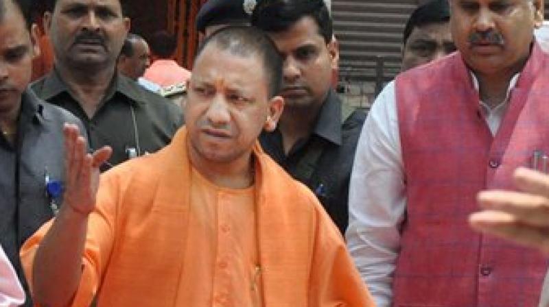 UP Chief Minister Yogi Adityanath arrives at circuit house for a meeting in Moradabad on Sunday. (Photo: PTI)