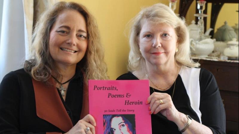 Poet Mary Ellen DAngelo-Lombardi (left) and artist Anne Marie Zanfagna display their book on Monday, May 7, 2018 in Plaistow, N.H. The book, called \Portraits, Poems & Heroin: 30 Souls Tell the Story,\ combines poetry DAngelo-Lombardi wrote about her sons friend who died of an overdose with portraits Zanfagna painted of her daughter and other overdose victims. (Photo: AP)