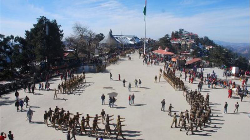 Personnel of Indian army, Himachal Pradesh police and ITBP march during the rehearsal for the upcoming Republic Day parade at Historical Ridge in Shimla on Friday. (Photo: PTI)