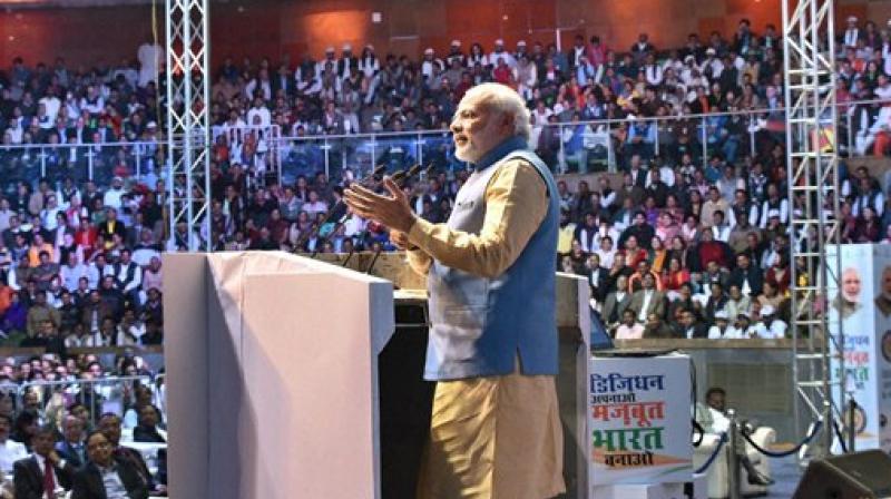 Prime Minister Narendra Modi addressing the gathering at the DigiDhan Mela in New Delhi on Friday. (Photo: PTI)