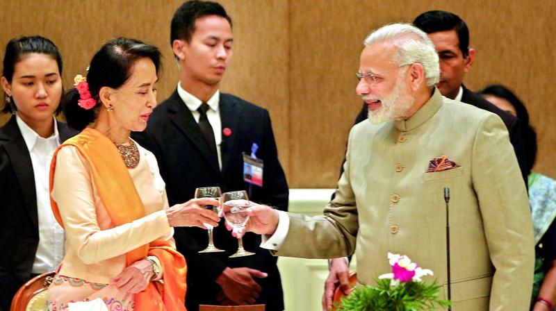 Myanmars state counsellor Aung San Suu Kyi offers a toast to Prime Minister Narendra Modi during a dinner at the Presidential palace in Myanmar on Tuesday. (Photo: AP)