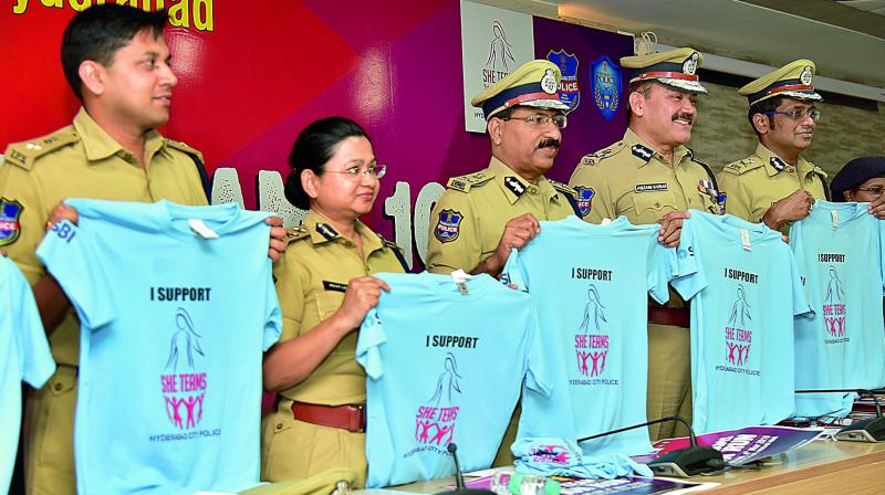 DGP M. Mahendar Reddy, SHE Teams head and additional CP (Crime) Swati Lakra and other senior police officers release a T-Shirt at the curtain raiser event of the annual SHE Teams 10K, 5K and 2K run to be held on March 4.  	DC