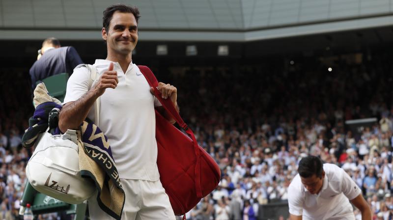 Roger Federer outclassed Milos Raonic 6-4, 6-2, 7-6(4) to make it to Wimbledon semifinal for a record 12th time. (Photo: AP)