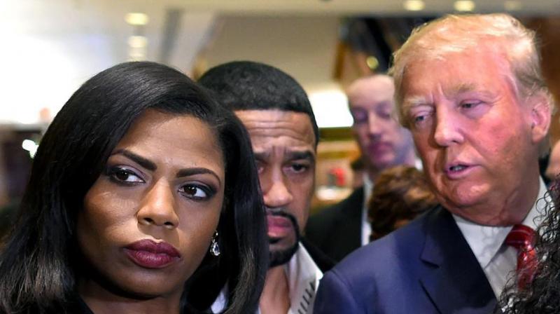 Omarosa Manigault Newman (left) appears alongside Donald Trump (right) during a press conference in New York. (Photo: AFP)