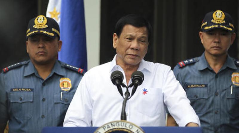Philippine President Rodrigo Duterte, center, speaks to erring policemen during an audience at the Presidential Palace grounds in Manila, Philippines on February 9. (Photo: AP)