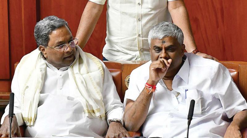 Former CM Siddaramaiah and minister H.D. Revanna during the Budget session in Bengaluru on Thursday  	KPN