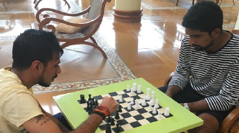 Chahal (left) is a former national level chess player and has represented India at Asian and World Youth championships. (Photo: BCCI Instagram)