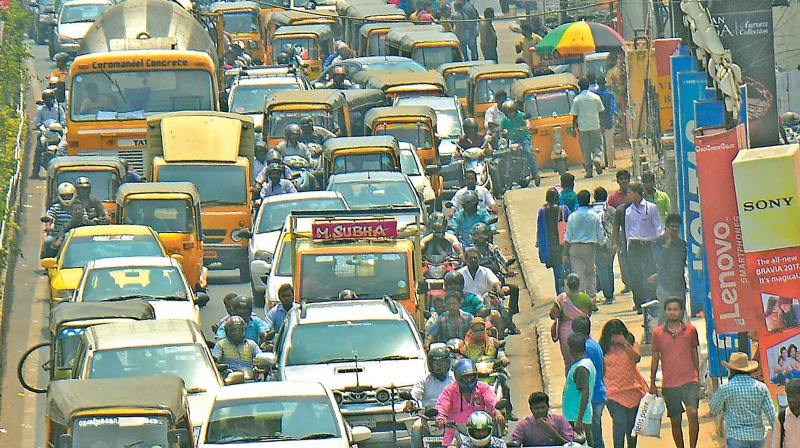 Vehicles moving slowly at Vadpalani junction on Saturday. (Photo: DC)