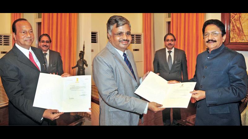 Ch. Vidyasagar Rao, Governor and chancellor of state universities, hands over appointment letters to Dr P. Duraisamy as Vice-Chancellor of University of Madras and Dr P.P. Chellathurai as Vice-Chancellor of Madurai Kamaraj University at Raj Bhavan in the city on Saturday. (Photo: DC)
