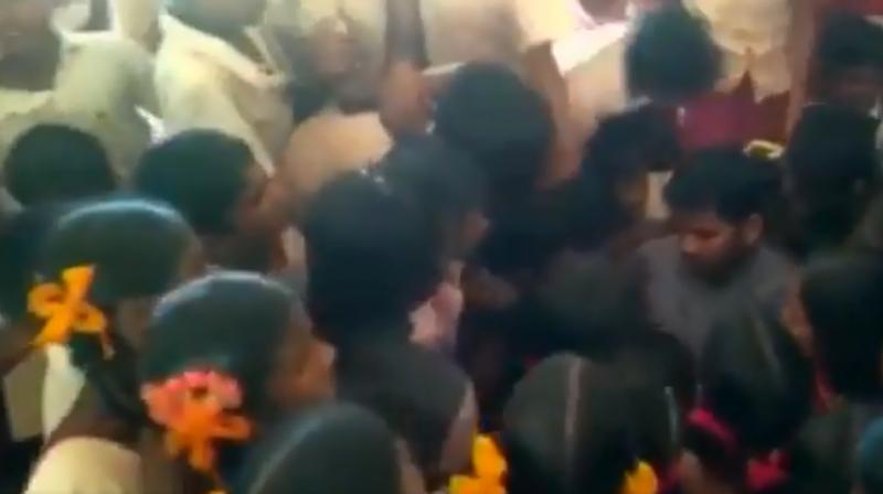 G Bhagwan was surrounded by students as they protested his transfer last week. (Photo: Screengrab/ANI)