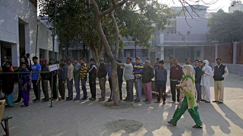 Voters standing in a queue to cast their votes at a polling station at Bhangel, Uttar Pradesh. (Photo: AP)