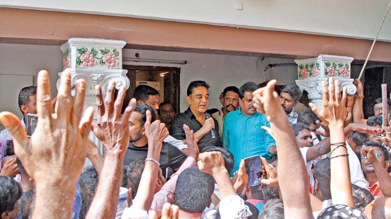 Actor Kamal Haasan interacts with his supporters at his residence in Alwarpet on Monday (Photo: DC)