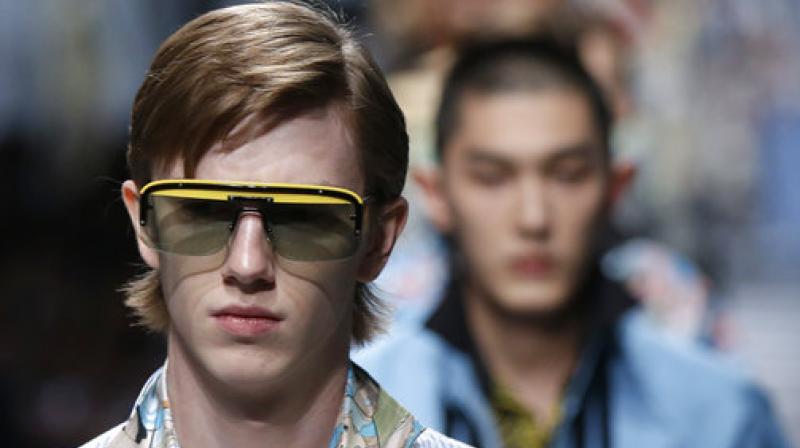 A model wears a creation part of the Prada mens Spring-Summer 2018 collection, presented in Milan, Italy, Sunday, June 18, 2017. (AP Photo/Luca Bruno)