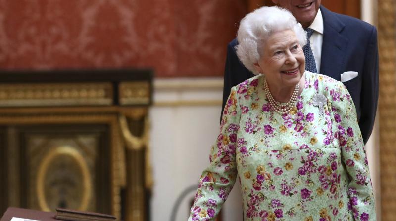 The Queen, notable lover of Corgis, is also the proud owner of another Corgi, Willow, and two Dorgis, Vulcan and Candy. (Photo: AP)