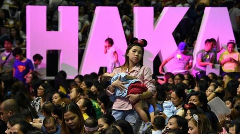 Hundreds of mothers suckled their babies inside a cavernous Manila stadium for a cause (Photo: AFP)
