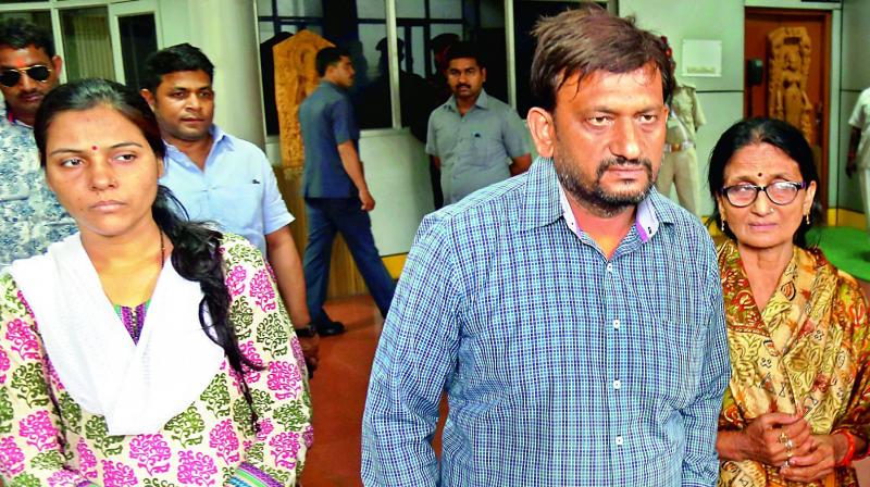 Family members of Karnataka Cadre IAS officer Anurag Tewari, who was found dead under mysterious conditions, coming out of the Annexe building after meeting Uttar Pradesh Chief Minister Yogi Adityanath in Lucknow on Monday. (Photo: PTI)