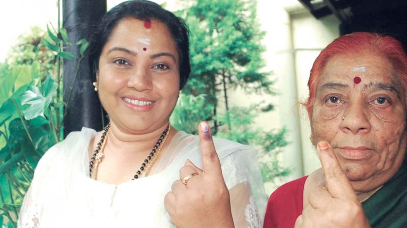 Actor Tara (right) with her mother after casting her vote in the Jayanagar assembly bypoll on Monday. (Photo:DC/KPN)