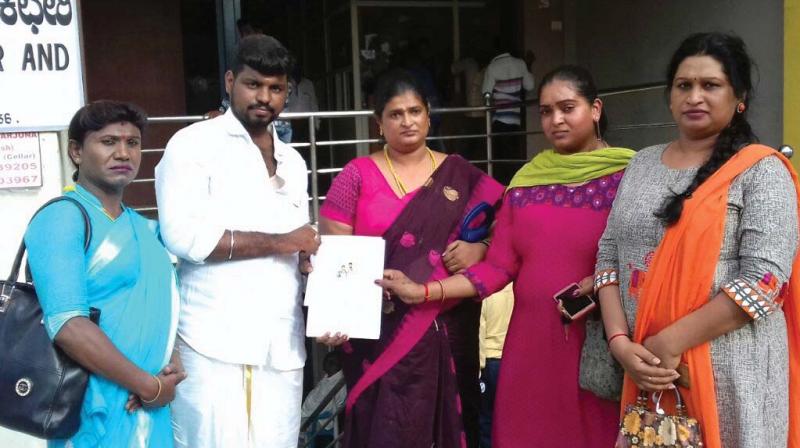 Transgender Savitha (second from right) after registering her marriage with Prasannan, an entrepreneur, at the K.R. Puram registrars office in Bengaluru.