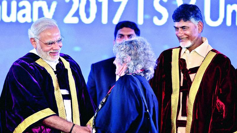 Prime Minister Narendra Modi shakes hands with Nobel laureate Ada E. Yonath during the inauguration of 104th Indian Science Congress at Sri Venkateswara University in Tirupati on Tuesday. Andhra Pradesh Chief Minister N. Chandrababu Naidu (right) is also seen. (Photo: PTI)