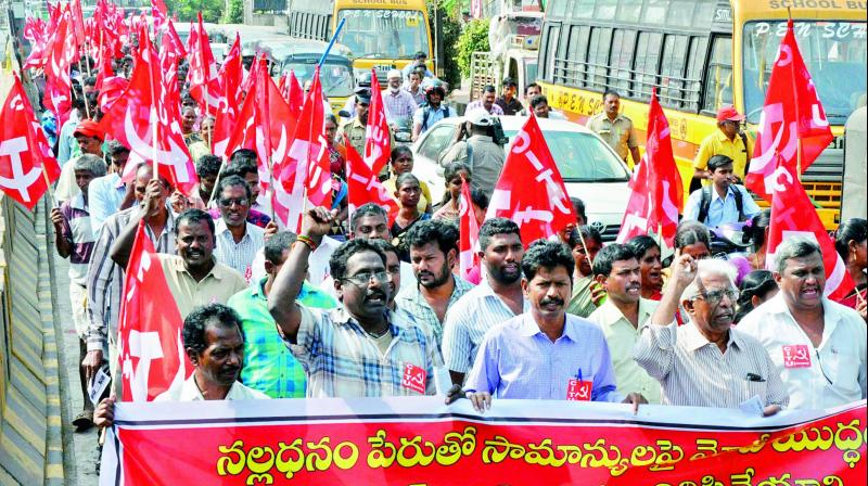 Left party activists take part in a procession protesting against the demonetisation, near Dabagardens in Visakhapatnam on Tuesday. (Photo: DC)