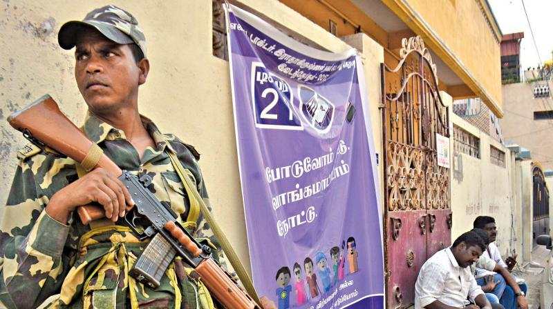Central Reserve Police Force (CRPF) stay vigilant at RK Nagar on Tuesday. (Photo: DC)